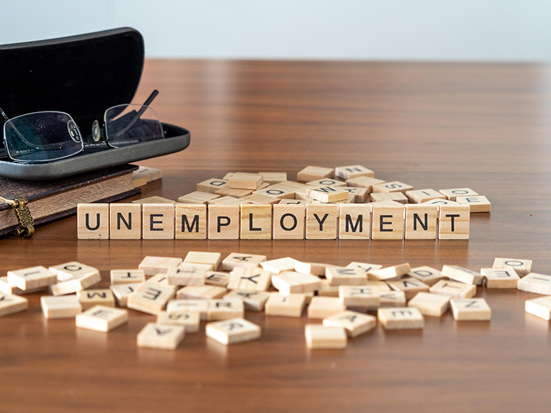 Unemployment spelled on wooden tiles