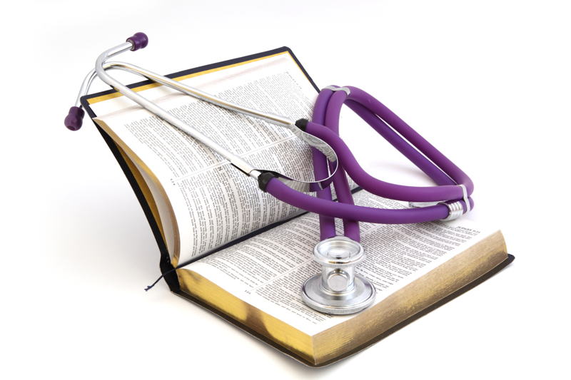 Stethoscope on top of a Bible