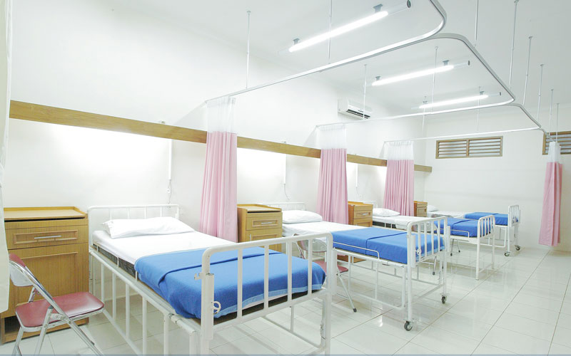 Image of interior of hospital showing empty hospital beds